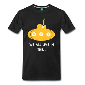 T-Shirt – We All Live In The.. (L)